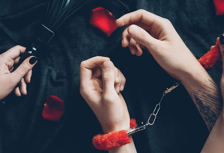 A hand holding a cell phone